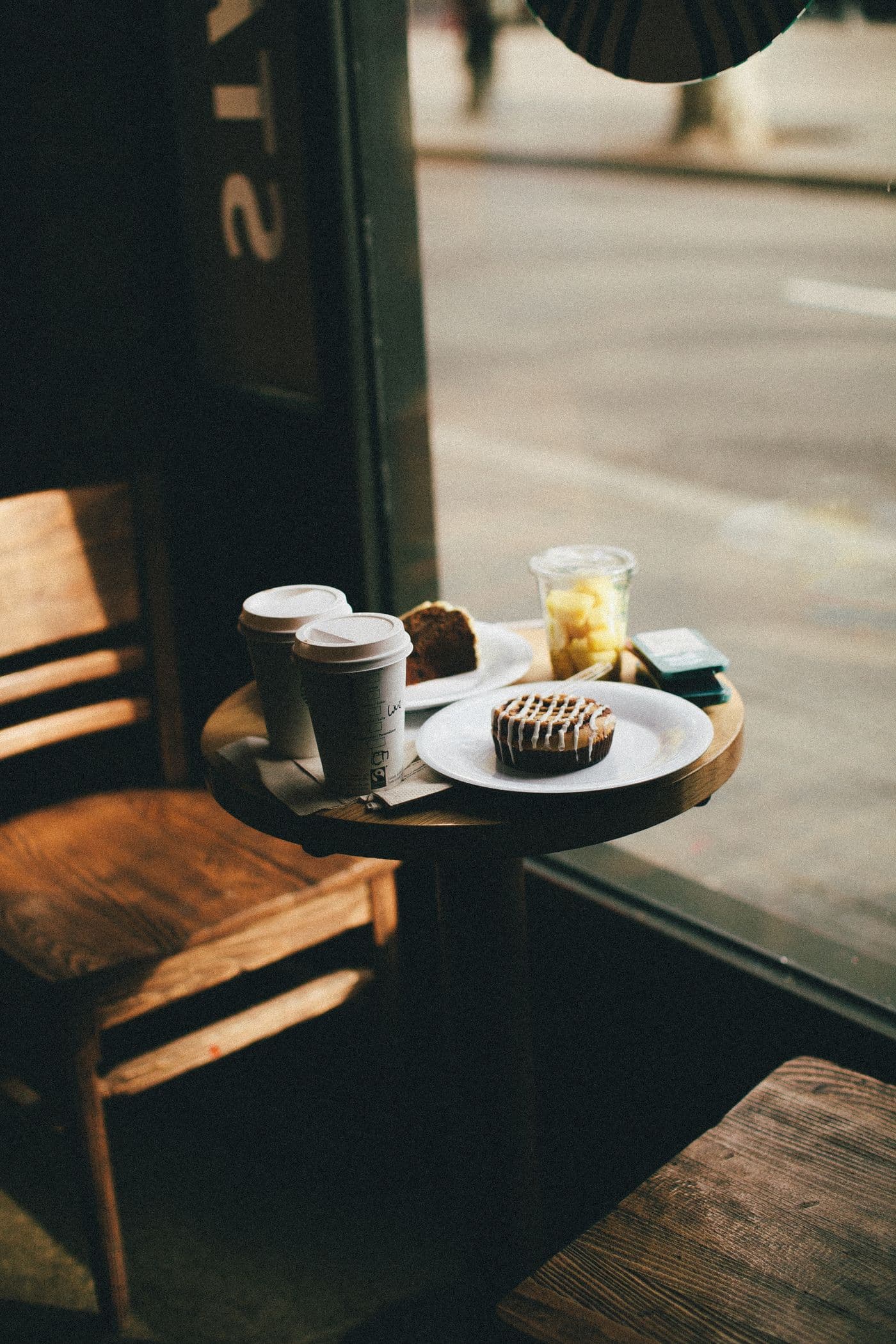 Coffee and food on a café window table